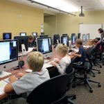 Children working in a computer lab at Saddlebrook Join-Use Facility