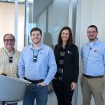 Jacob Butler presents on technology in MEPT engineering with other team members.