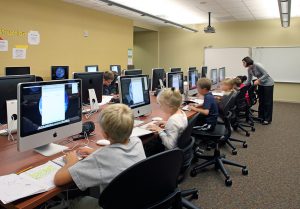 Children working in a computer lab at Saddlebrook Join-Use Facility