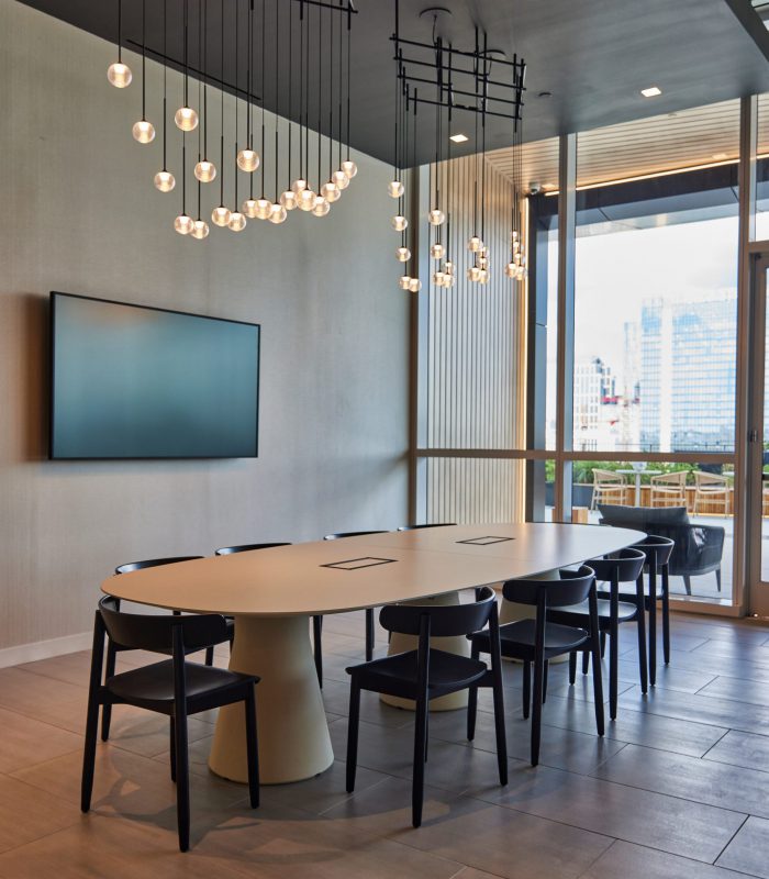 Interior shot of a large collaboration table in ONE22ONE Broadway in Nashville