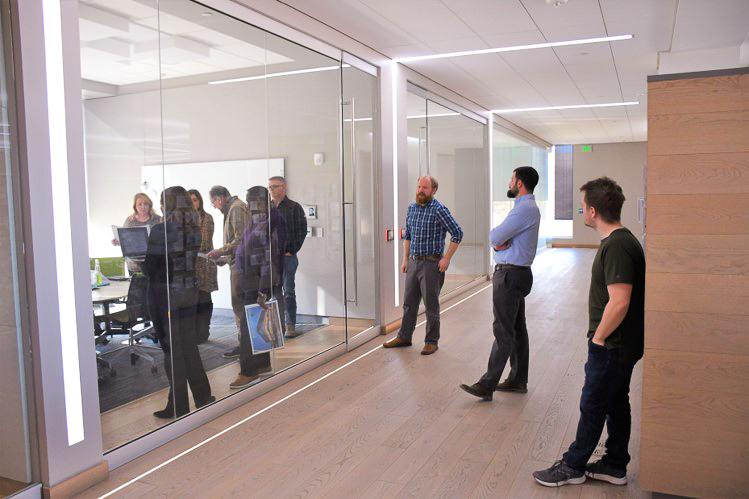 IPDG staff observe listening room during "Ears on Experience" acoustical consulting demo.